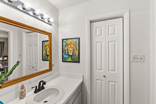 bathroom featuring a closet and vanity