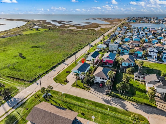 bird's eye view with a residential view and a water view