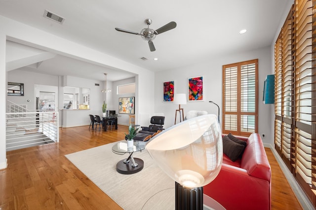 living area with recessed lighting, visible vents, wood finished floors, and ceiling fan