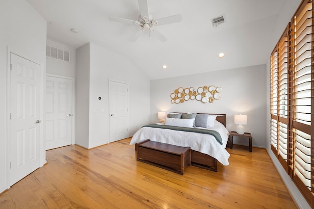 bedroom featuring visible vents, recessed lighting, light wood-type flooring, and lofted ceiling