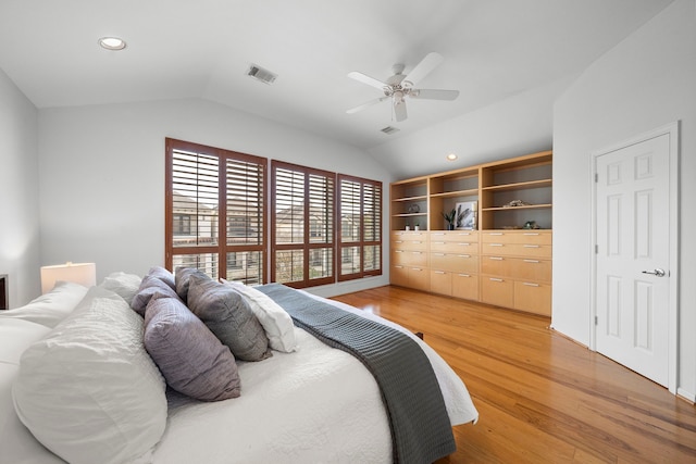 bedroom featuring lofted ceiling, recessed lighting, visible vents, and light wood finished floors