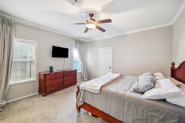 bedroom with visible vents, crown molding, baseboards, light colored carpet, and ceiling fan