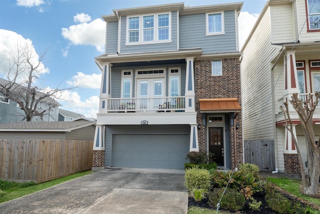 view of front of house featuring a garage, brick siding, concrete driveway, and fence