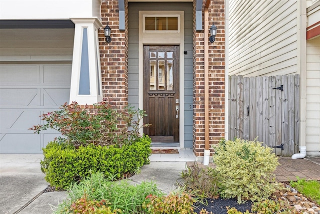 view of exterior entry with brick siding