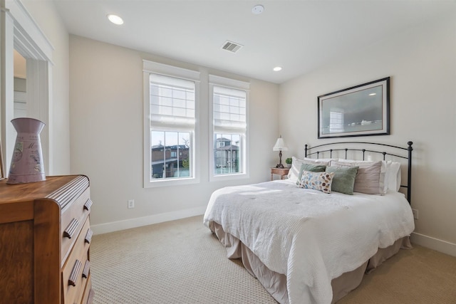 bedroom featuring recessed lighting, visible vents, baseboards, and carpet