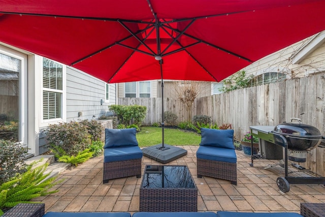 view of patio featuring area for grilling, an outdoor hangout area, and fence