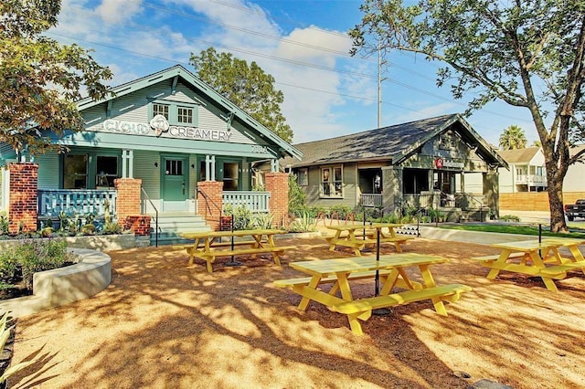 back of house with covered porch