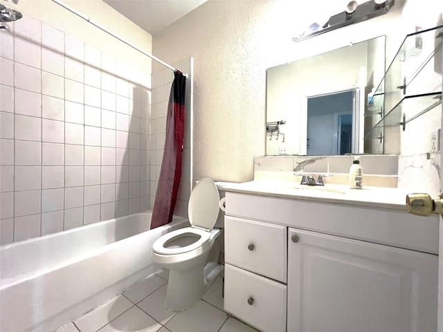 bathroom with tile patterned flooring, toilet, shower / bath combo, a textured wall, and vanity