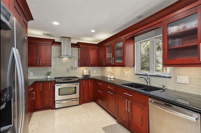 18531 Point Lookout Dr, Houston, TX 77058 - kitchen with appliances with stainless steel finishes, wall chimney exhaust hood, dark brown cabinets, a sink, and tasteful backsplash