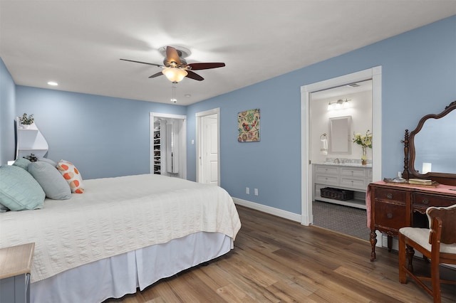 18531 Point Lookout Dr, Houston, TX 77058 - bedroom featuring baseboards, wood finished floors, a closet, ensuite bathroom, and ceiling fan