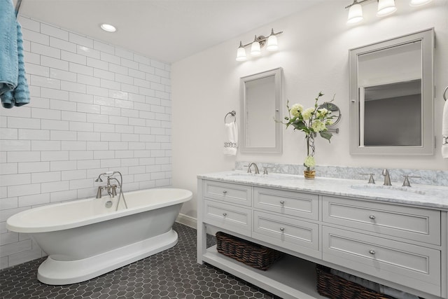 18531 Point Lookout Dr, Houston, TX 77058 - bathroom featuring double vanity, a soaking tub, tile walls, and tile patterned floors