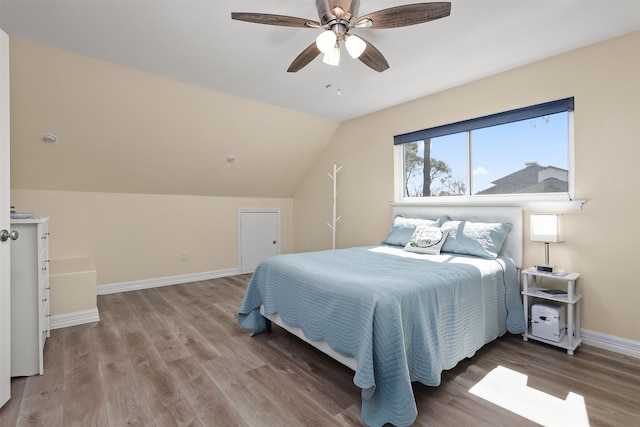 18531 Point Lookout Dr, Houston, TX 77058 - bedroom with wood finished floors, baseboards, vaulted ceiling, and ceiling fan