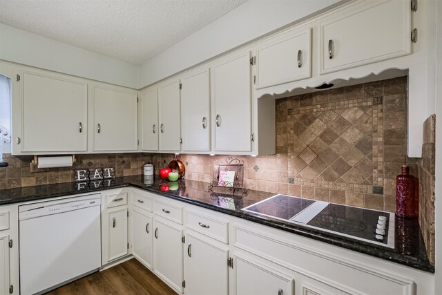 kitchen featuring black electric cooktop, tasteful backsplash, dishwasher, and a textured ceiling