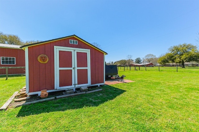 view of shed with fence