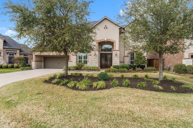 view of front of house featuring stucco siding, stone siding, concrete driveway, and a front lawn