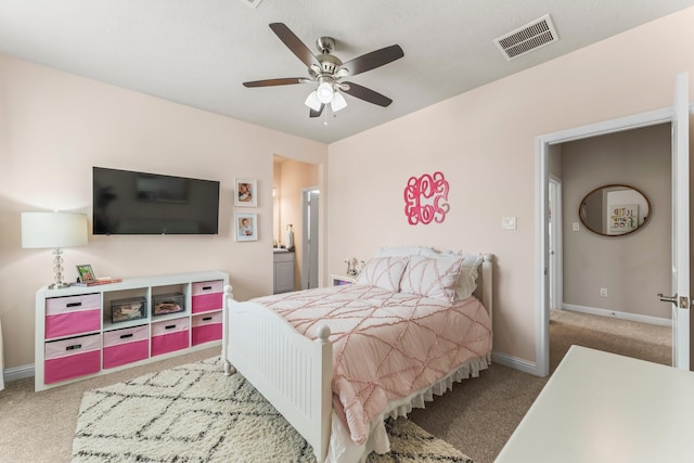 bedroom featuring visible vents, baseboards, carpet, and a ceiling fan