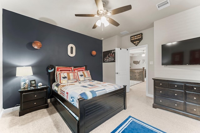 bedroom featuring carpet flooring, baseboards, visible vents, and ceiling fan