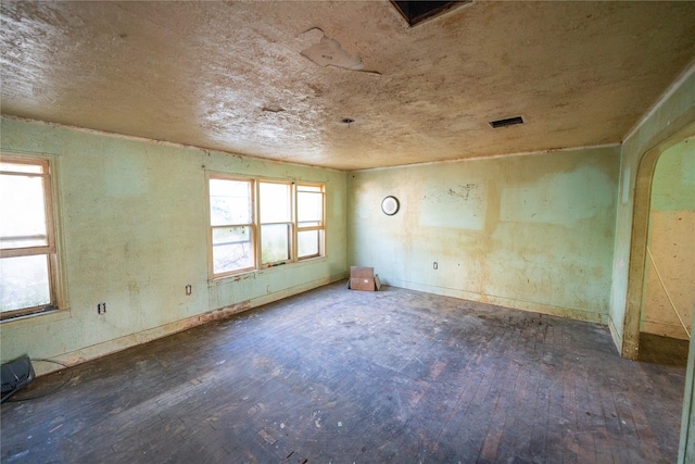 unfurnished room featuring hardwood / wood-style flooring