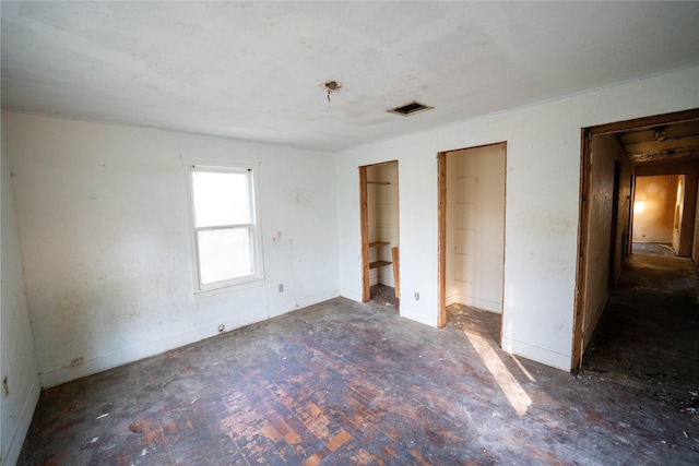 unfurnished bedroom with visible vents