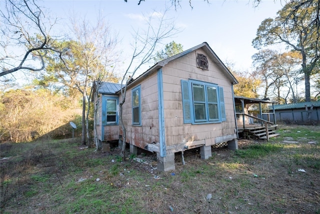 view of property exterior with metal roof