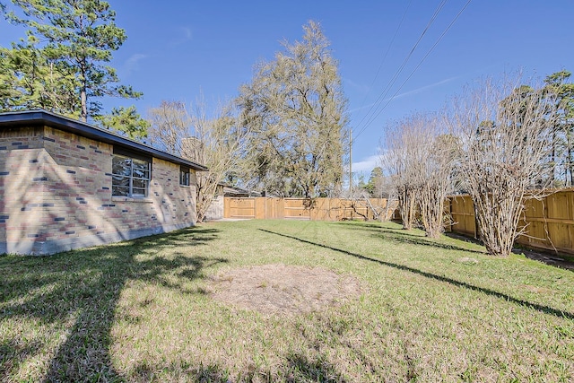 view of yard with a fenced backyard