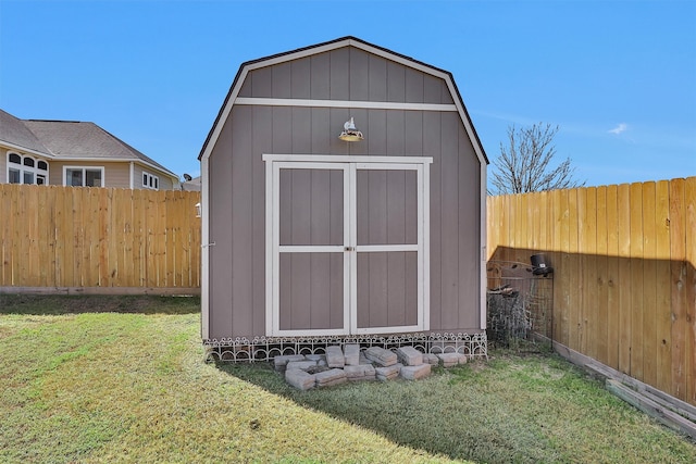 view of shed with a fenced backyard