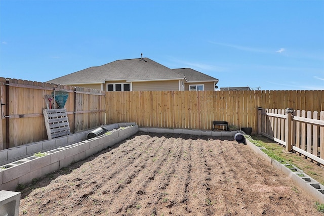 view of yard with a fenced backyard