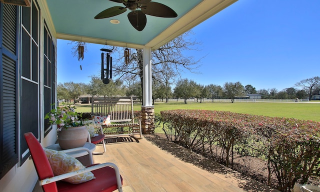 exterior space featuring a porch and a ceiling fan