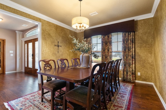 dining space with wood finished floors, visible vents, baseboards, wallpapered walls, and crown molding