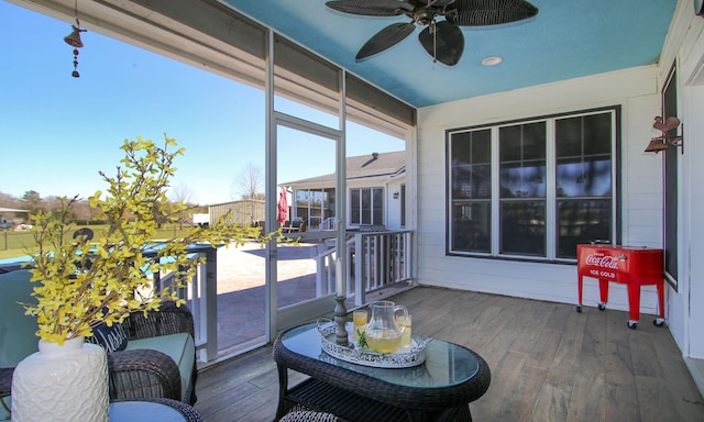 exterior space with ceiling fan