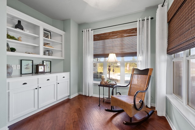 sitting room featuring dark wood finished floors and baseboards