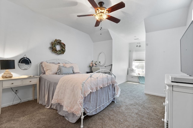 bedroom with baseboards, light carpet, lofted ceiling, and a ceiling fan