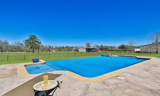 view of pool with a yard, a fenced in pool, a fenced backyard, and a patio area