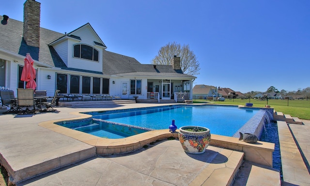 view of swimming pool with a fenced in pool, an in ground hot tub, outdoor dining space, and a patio area