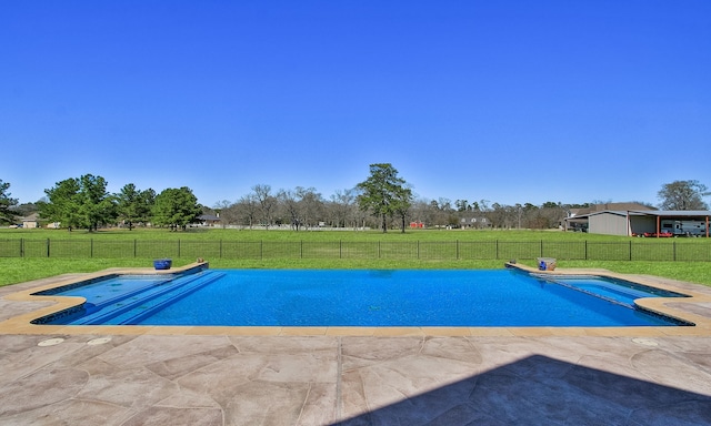 view of swimming pool with a fenced in pool, a lawn, a fenced backyard, and a patio area