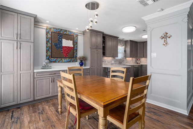 dining room featuring dark wood-style floors and visible vents