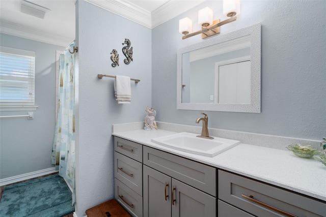 bathroom featuring vanity and ornamental molding