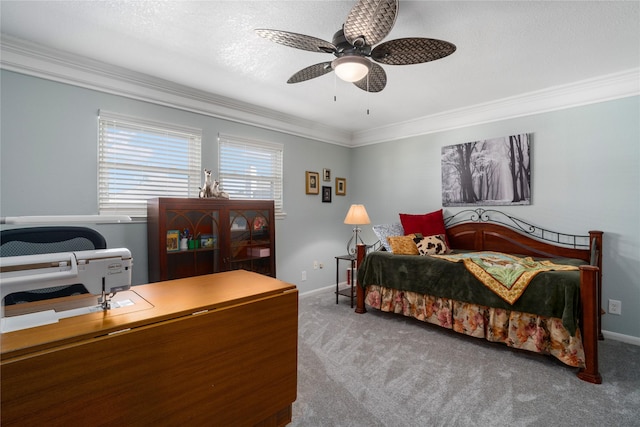 carpeted bedroom with ceiling fan, a textured ceiling, baseboards, and ornamental molding