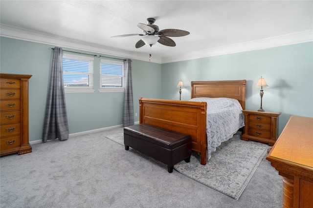 bedroom featuring a ceiling fan, baseboards, carpet floors, and ornamental molding