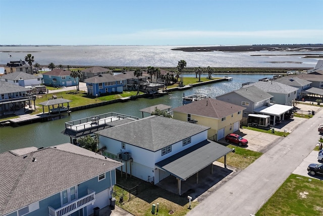 bird's eye view with a residential view and a water view