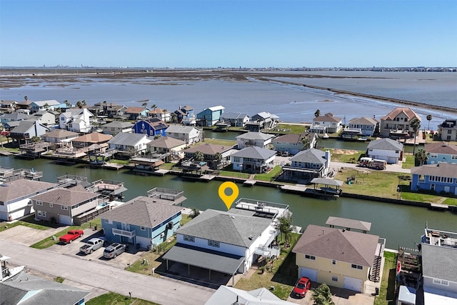 birds eye view of property with a residential view and a water view