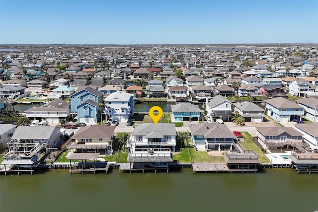 drone / aerial view with a residential view and a water view