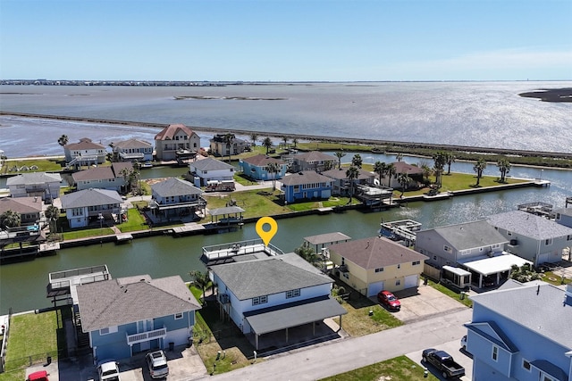 birds eye view of property with a residential view and a water view