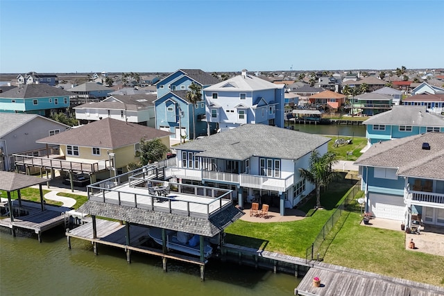 birds eye view of property featuring a residential view and a water view