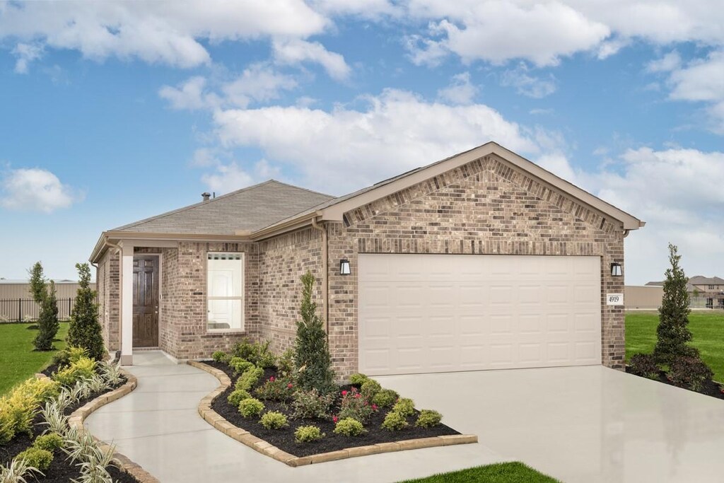 4919 Abbey Manor Ln, Katy, TX 77493 - ranch-style home featuring a garage, brick siding, concrete driveway, and a front yard