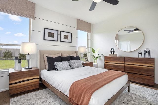 bedroom with ceiling fan and wood finished floors