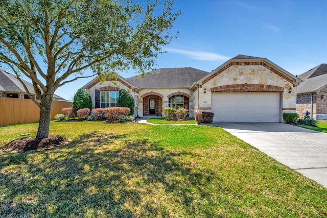 french country home with a front lawn, fence, concrete driveway, stone siding, and an attached garage