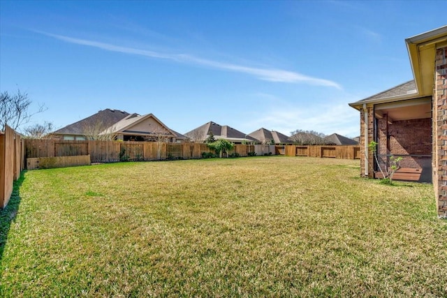 view of yard featuring a fenced backyard