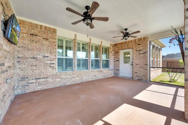 view of patio / terrace featuring a ceiling fan and fence