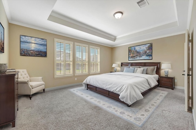 carpeted bedroom featuring visible vents, a raised ceiling, and baseboards